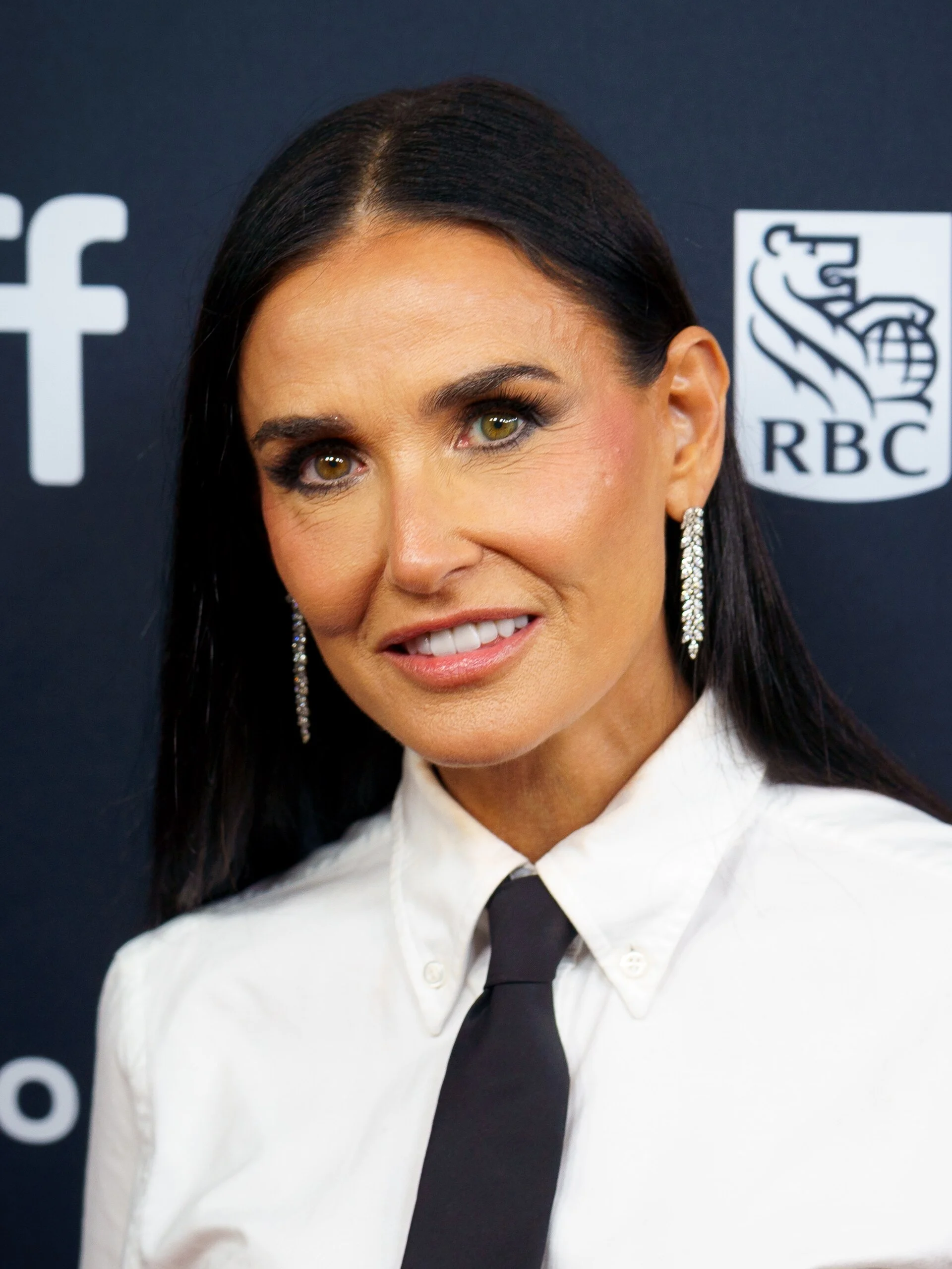 Demi Moore photographed at a film festival in 2024. Licensed image; it identifies the person only and is not evidence of any dental treatment.